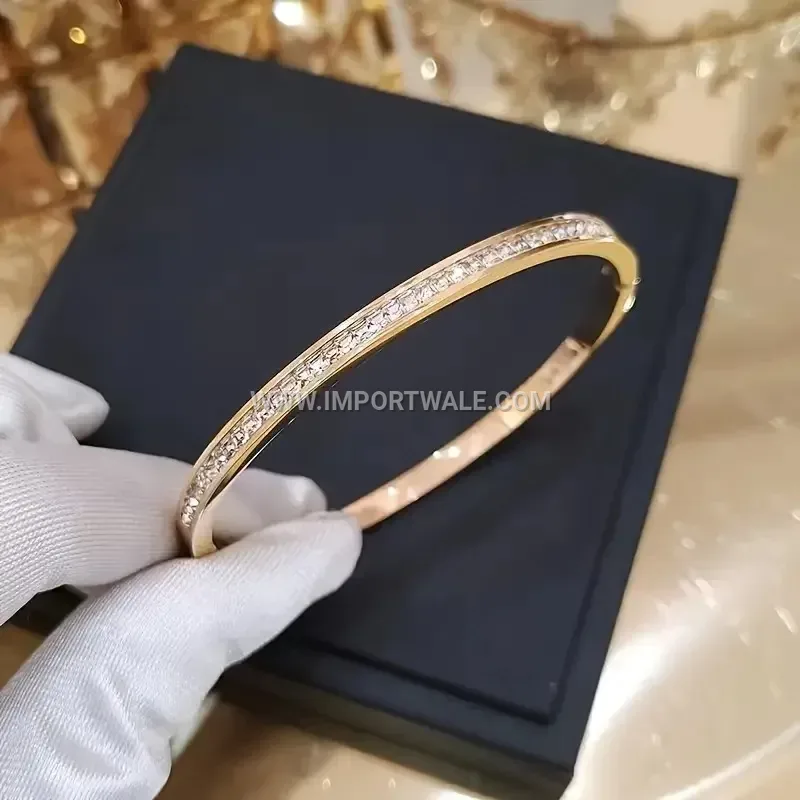 Delicate Stainless Steel Oval Bangle Accentuated with Square Cubic Zirconia