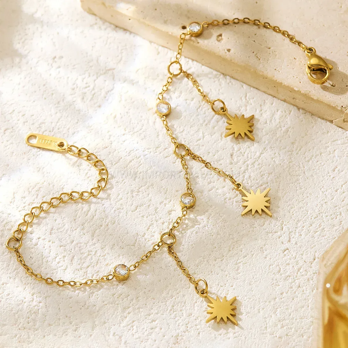 Stainless Steel Eight Point Star Tassel Bracelet with Cubic Zirconia Accent