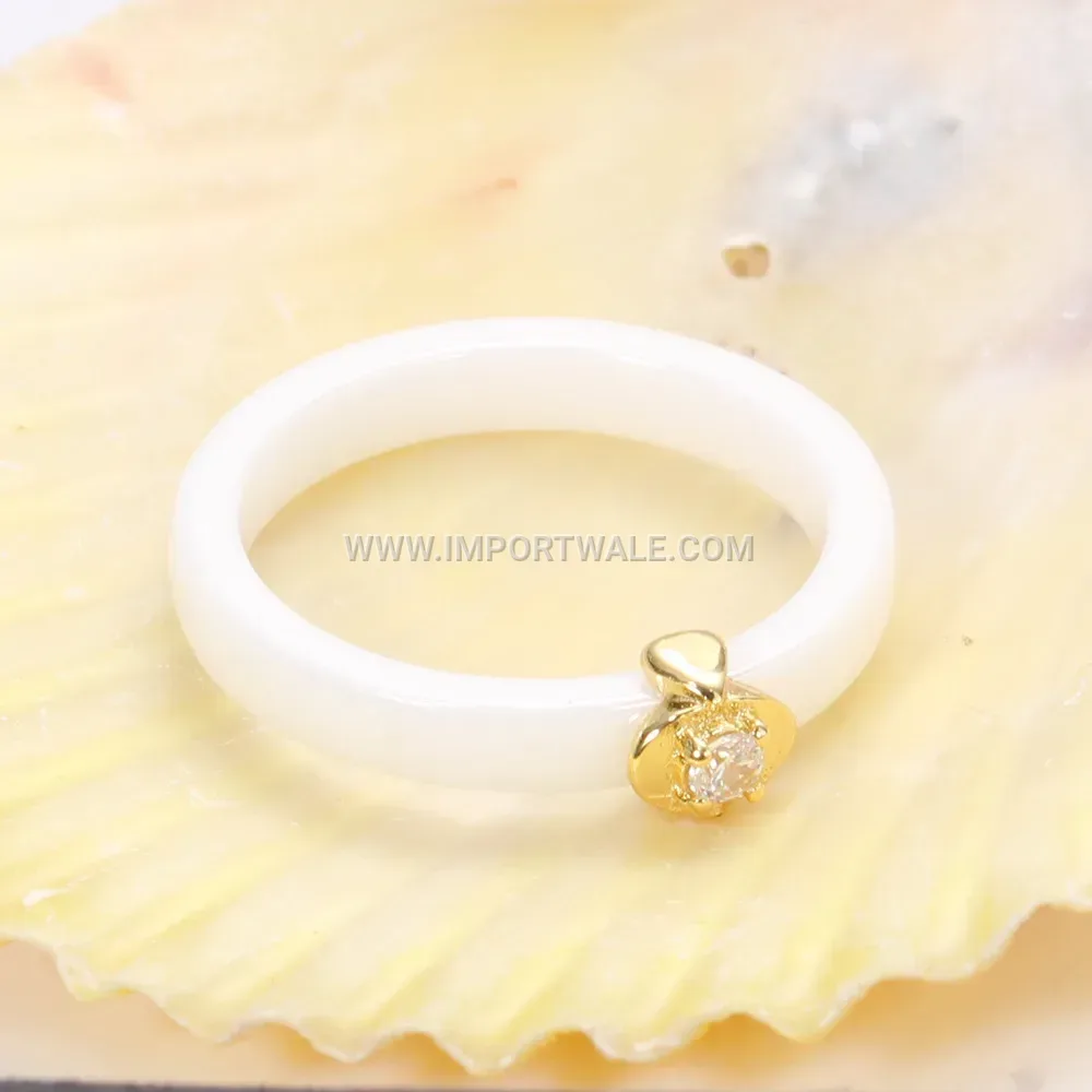 Cubic Zirconia Embedded Ceramic Gold Trimmed Ring