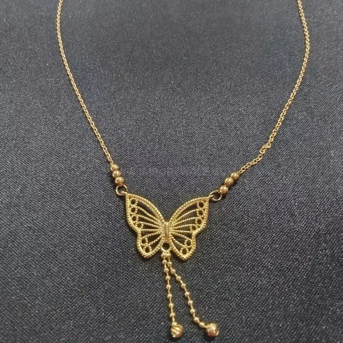 Trendy Gold Cutout Butterfly Tassel Stainless Steel Necklace