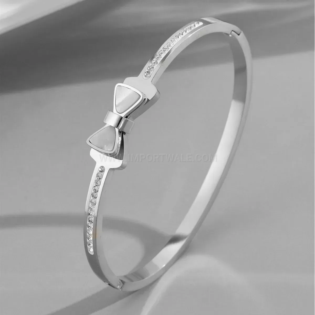 Classic Faux Shell Bow Accent Titanium Steel Clasp Bangle