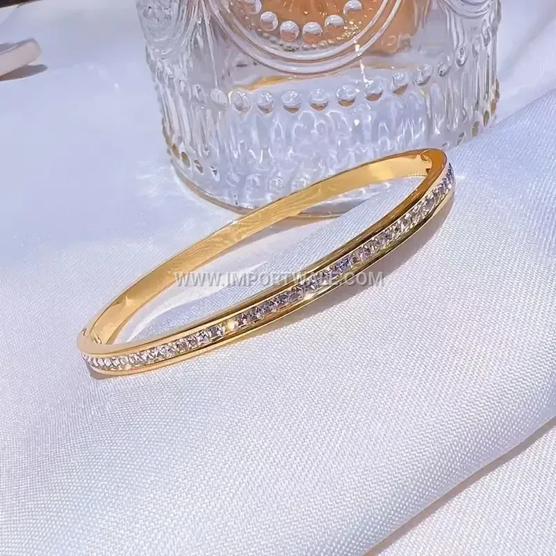 Delicate Stainless Steel Oval Bangle Accentuated with Square Cubic Zirconia
