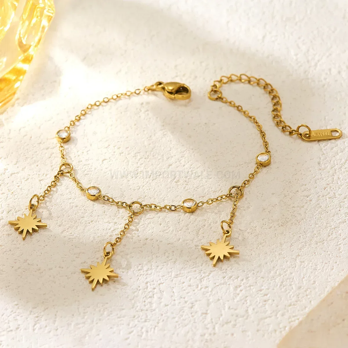 Stainless Steel Eight Point Star Tassel Bracelet with Cubic Zirconia Accent