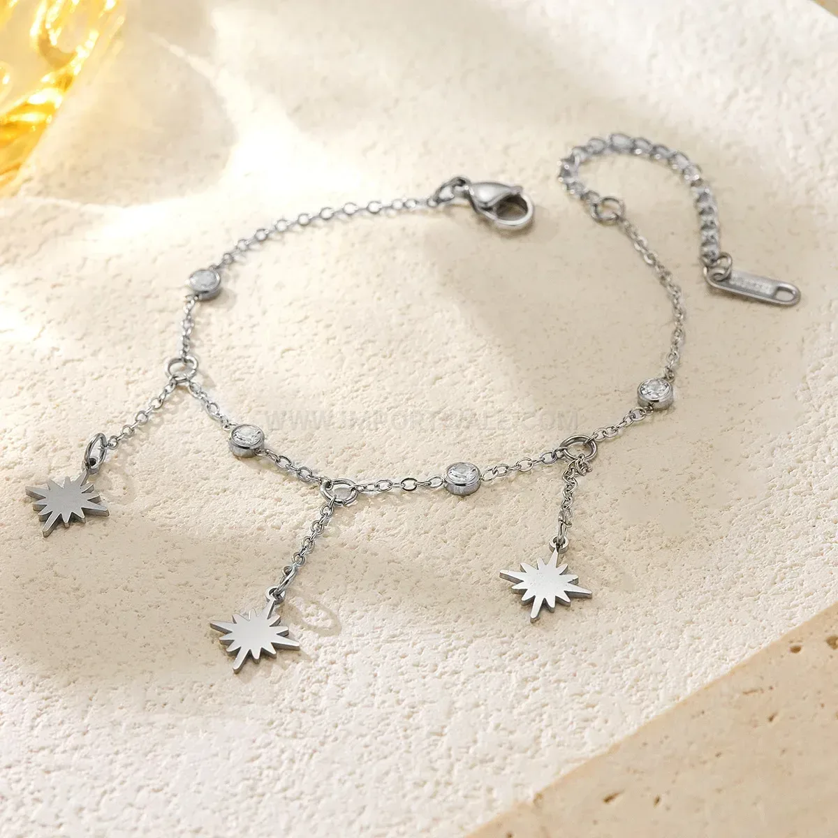 Stainless Steel Eight Point Star Tassel Bracelet with Cubic Zirconia Accent