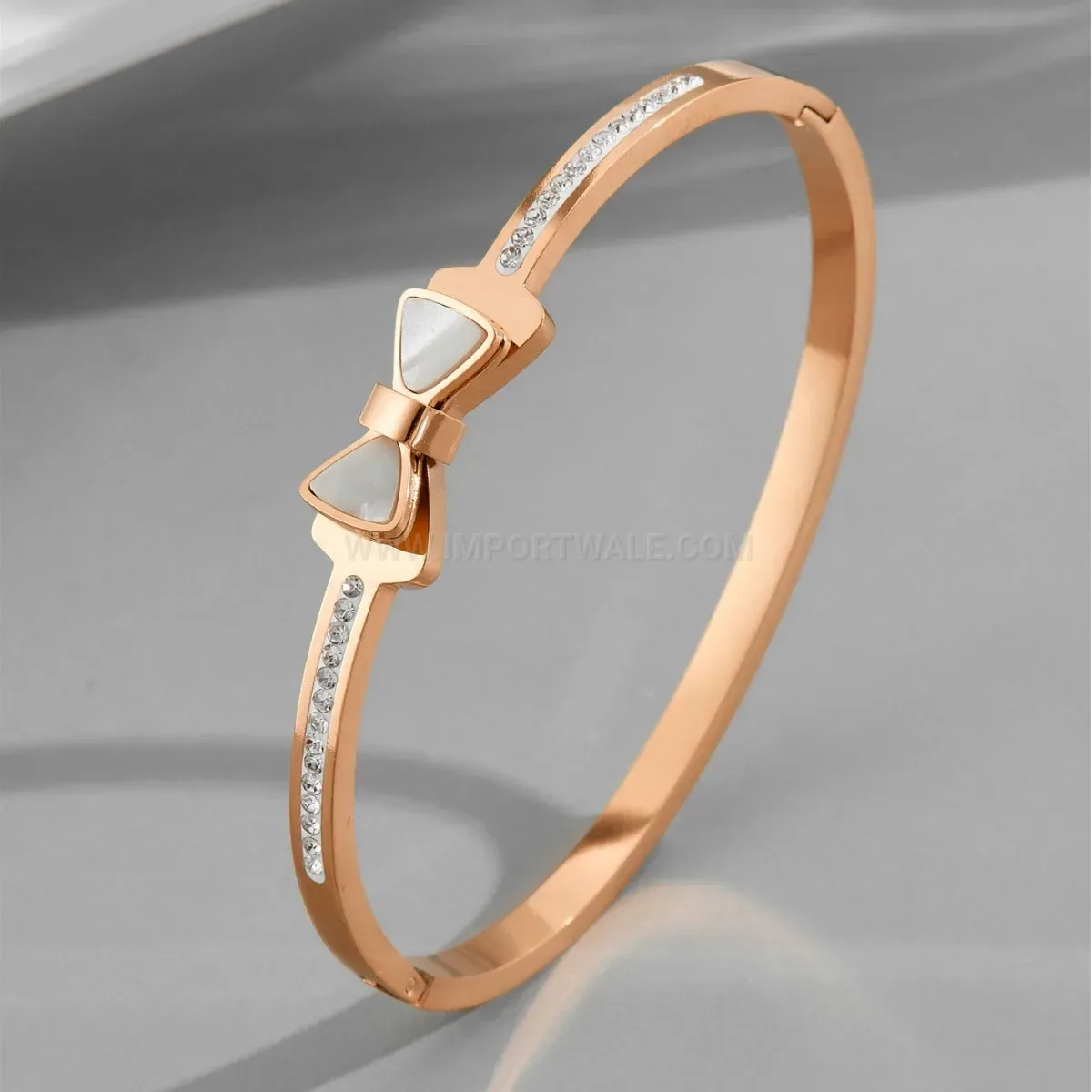 Classic Faux Shell Bow Accent Titanium Steel Clasp Bangle