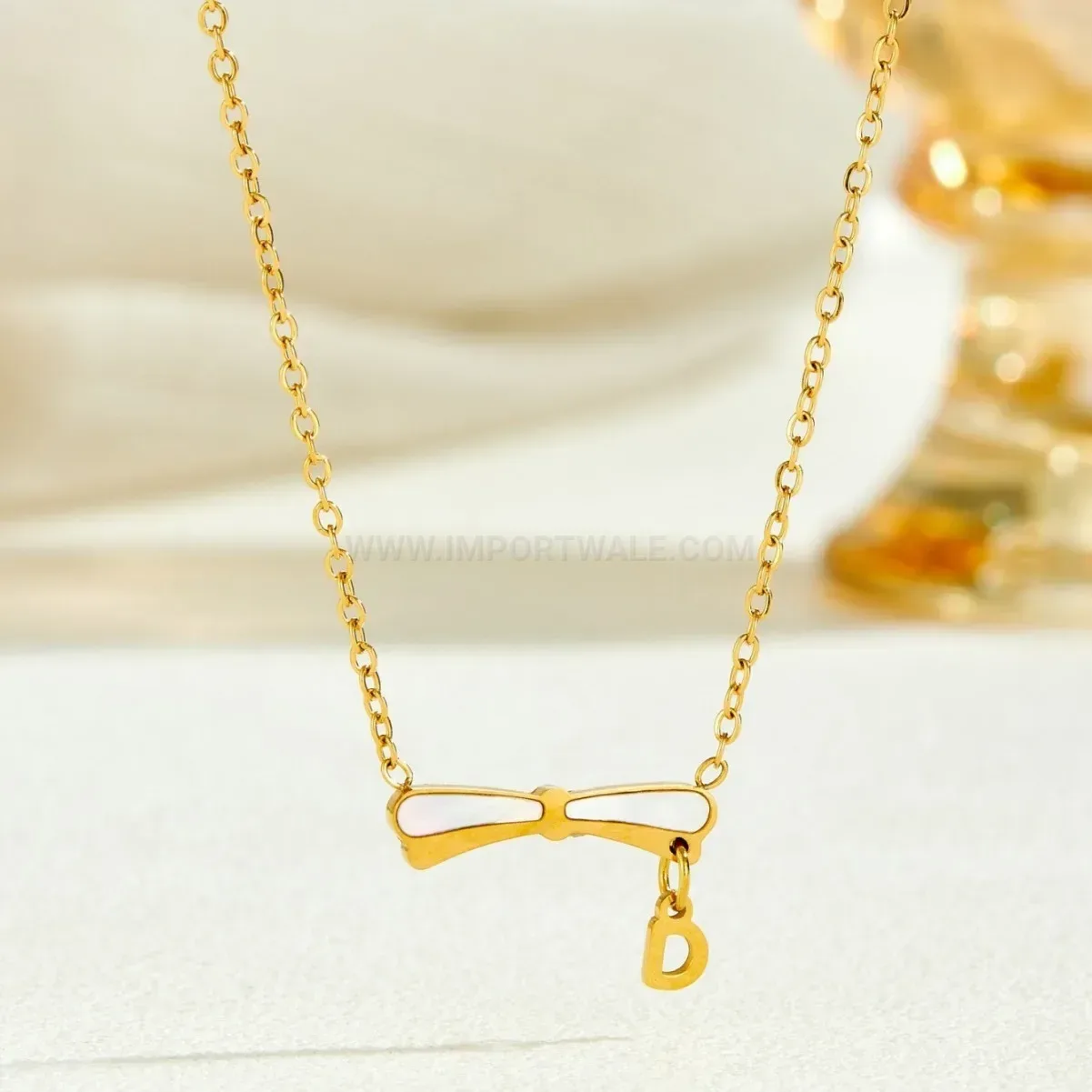Gold Plated Titanium Steel Bow Pendant Blade Chain Necklace