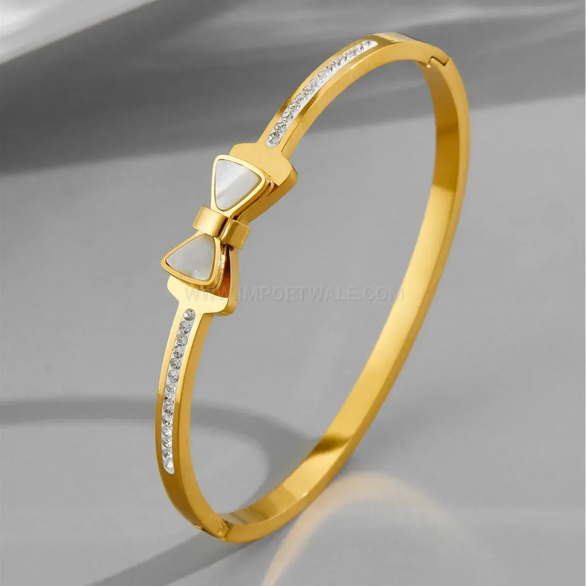 Classic Faux Shell Bow Accent Titanium Steel Clasp Bangle