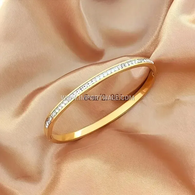 Delicate Stainless Steel Oval Bangle Accentuated with Square Cubic Zirconia